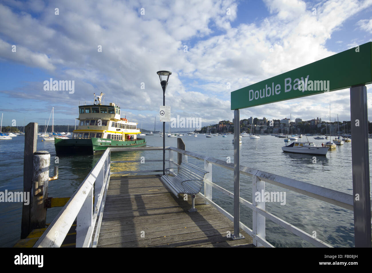 Ferry pulling away from Double Bay wharf in Sydney Harboour Stock Photo