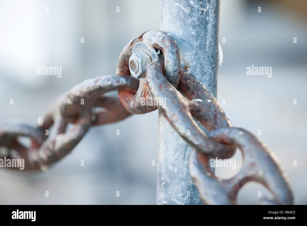 Fragment of rusty metal chain railing in Key West harbor, Florida. Stock Photo