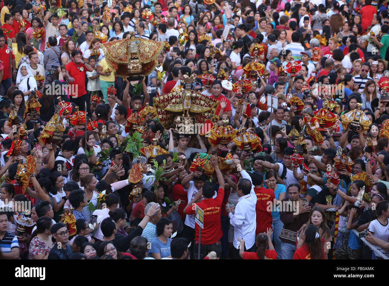 Cebu City, Philippines. 07th Jan, 2016. Following a dawn procession starting at 4:30 am, thousands of Filipino Catholics flock to the oldest Roman Catholic Church in the Philippines - the Basilica Minore del St.Nino in Cebu City. The event marks the official start of the Fiesta Señor - a nine day religious festival honouring the Santo Nino De Cebu (Holy Child of Cebu) Many devotees bring with them a Santo Nino figurine representing the Child Jesus. Credit:  imagegallery2/Alamy Live News Stock Photo