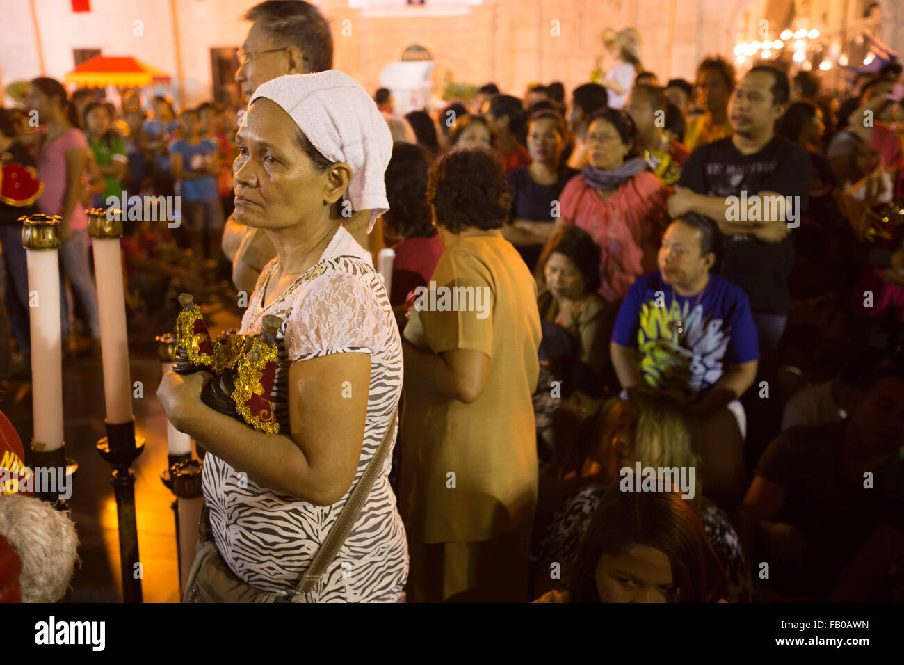 Cebu City, Philippines. 07th Jan, 2016. Following a dawn procession starting at 4:30 am, thousands of Filipino Catholics flock to the oldest Roman Catholic Church in the Philippines - the Basilica Minore del St.Nino in Cebu City. The event marks the official start of the Fiesta Señor - a nine day religious festival honouring the Santo Nino De Cebu (Holy Child of Cebu) Many devotees bring with them a Santo Nino figurine representing the Child Jesus. Credit:  imagegallery2/Alamy Live News Stock Photo