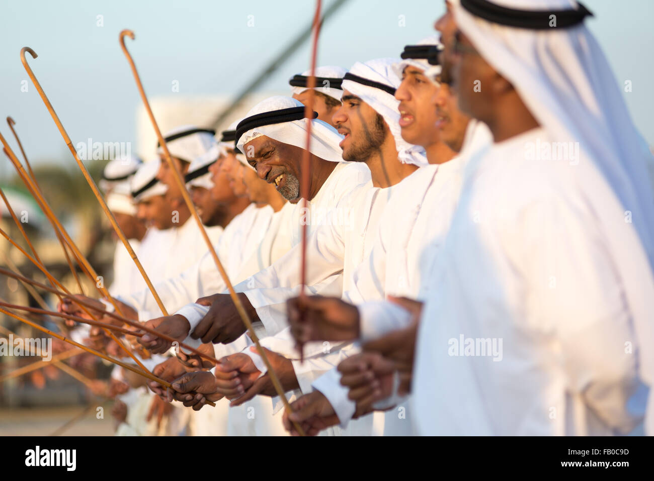 Arab men taking part in traditional dance at Sheikh Zayed Heritage