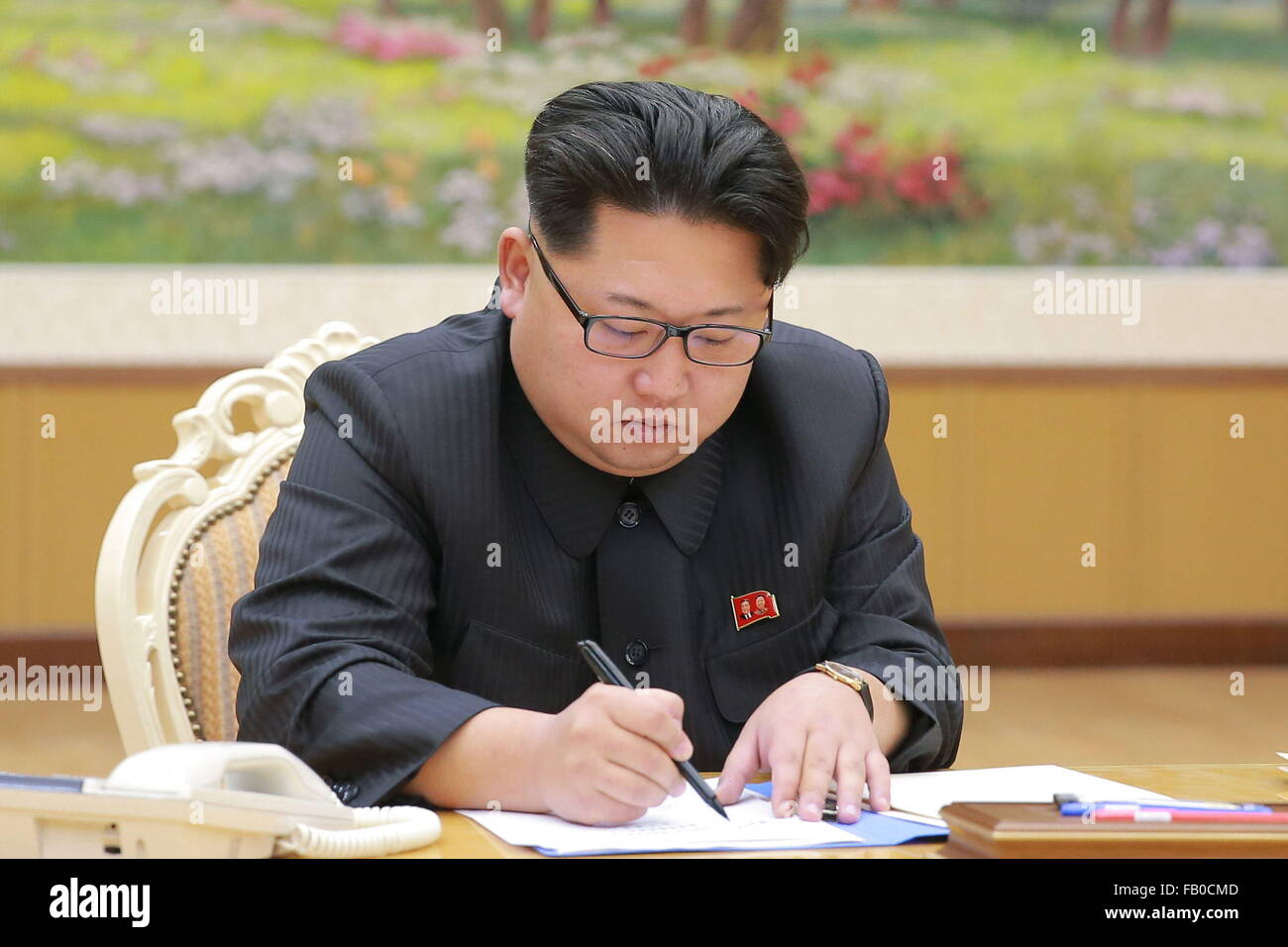 Pyongyang. 15th Dec, 2015. Photo provided by the Korean Central News Agency (KCNA) on Jan. 7, 2016 shows top leader of the Democratic People's Republic of Korea (DPRK) Kim Jong Un signing the final written order of the hydrogen bomb test on Jan. 3, 2016. Kim Jong Un ordered the H-bomb test on Dec. 15, 2015, and signed the final written order on Sunday. © KCNA/Xinhua/Alamy Live News Stock Photo