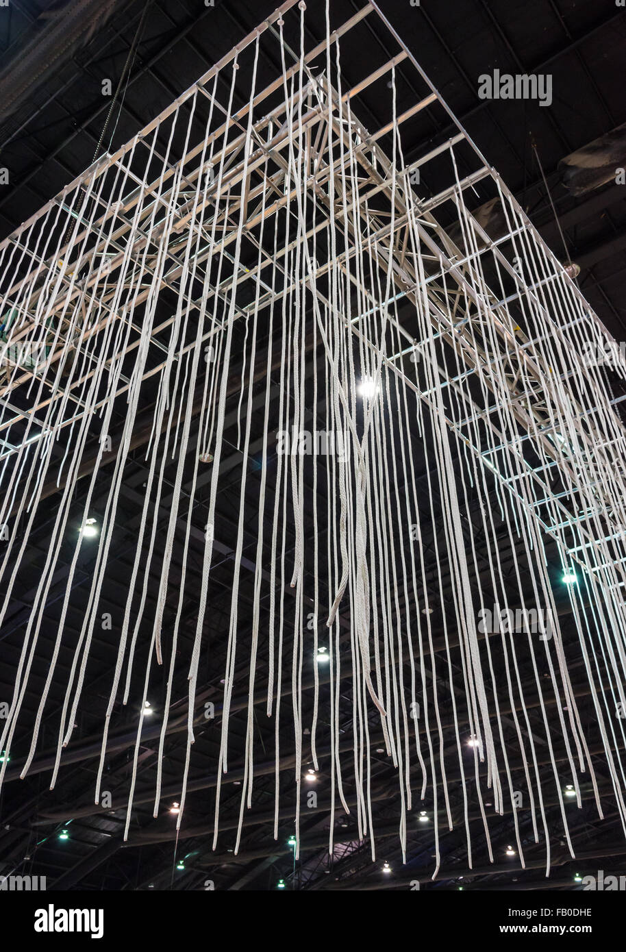 White rope group is hanging from the exhibition ceiling. Stock Photo