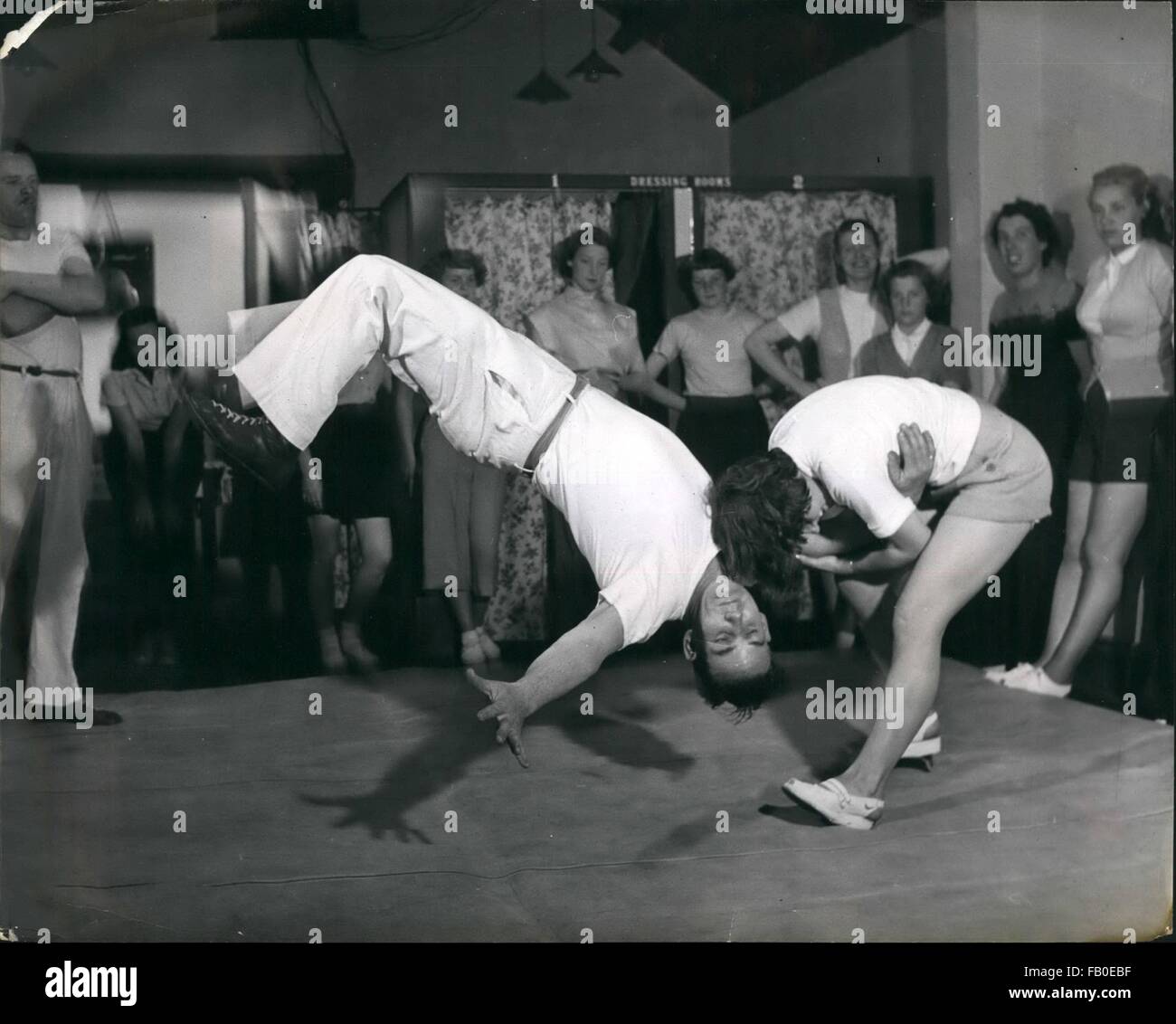 1962 - The ''Flying Mare'' a hold very suitable to lady judo exponents because strength is unnecessary. Demonstrating it is Shelagh Webb, aged 15 and the ''Victim'' is instructor Philo Vance. Miss Webb can throw a man of up to 17 stone in weight with this action. But she fell for him . Judo Expert To Marry his Pupil. He is a Judo expert - so he will land quite lightly - but she did not land quite so lightly- for she fell in love., for he is Eric Ingram a judo instructor - and she is his pupil 10 year old june watts and they are to be married next work at Enfield. Middlesex. Watching the happ Stock Photo