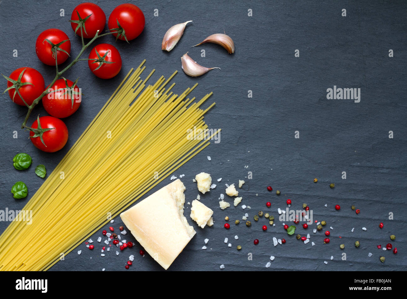 Spaghetti pasta ingredients abstract food on black background concept ...