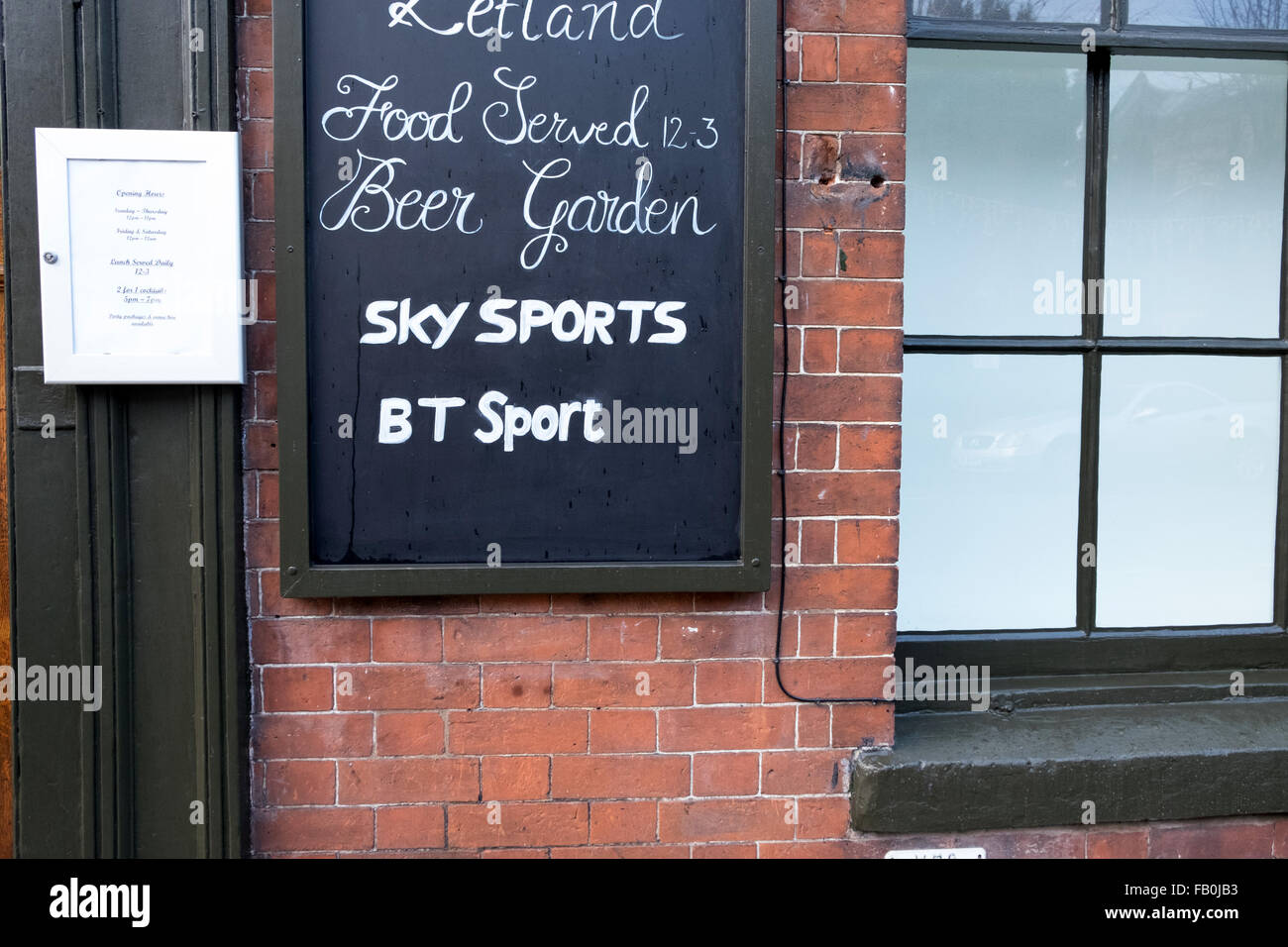 Sign outside a pub advertising Sky Sports and BT sport Stock Photo