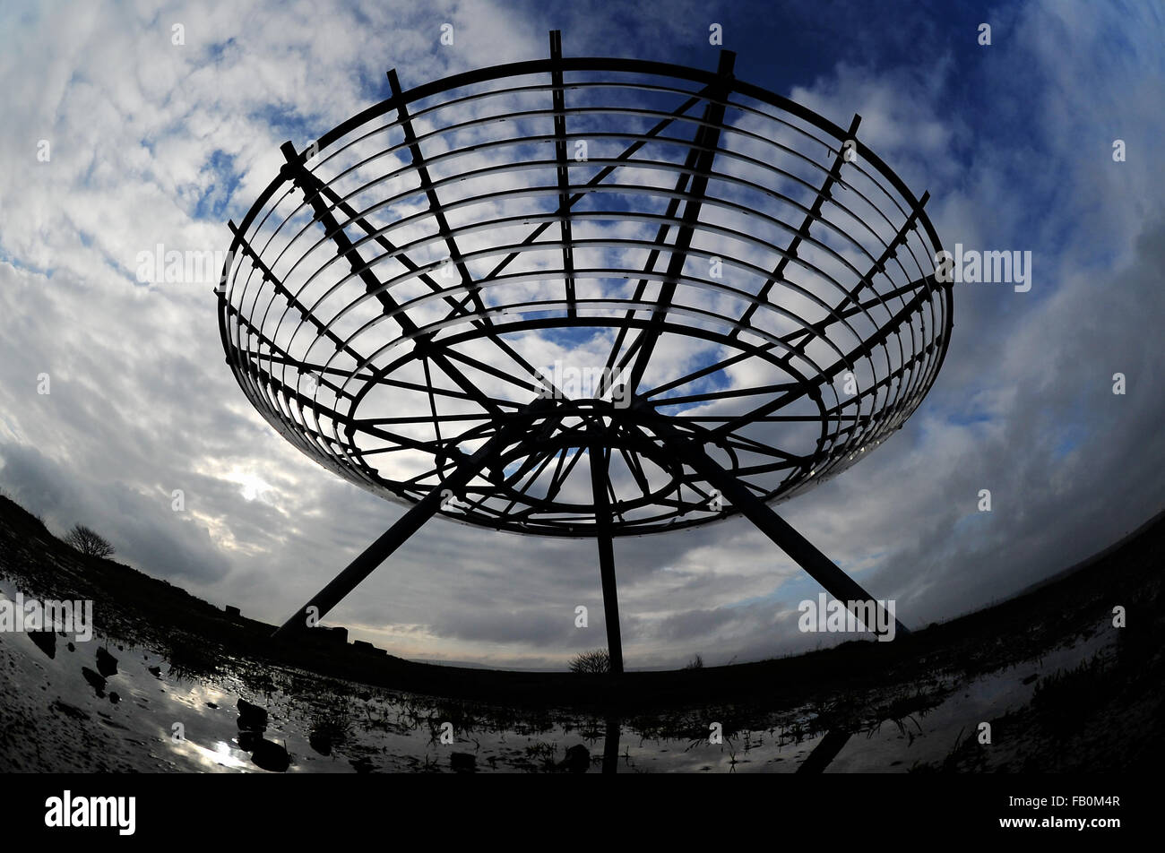 A walker stops to admire the view of The Halo panopticon on the hills ...