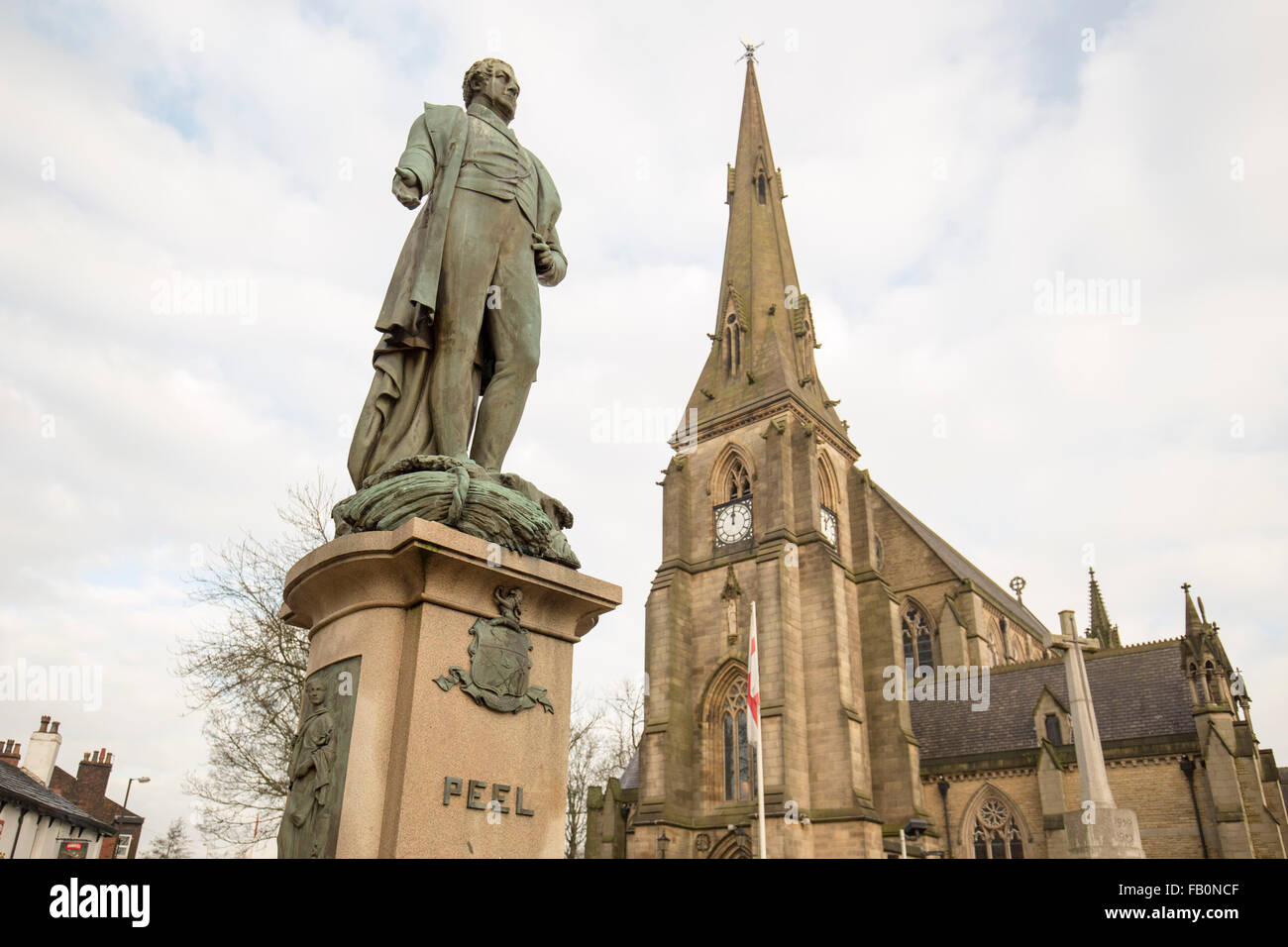 The Peel Memorial statue , Bury , with St Mary's Parish Church, Bury to the right Stock Photo