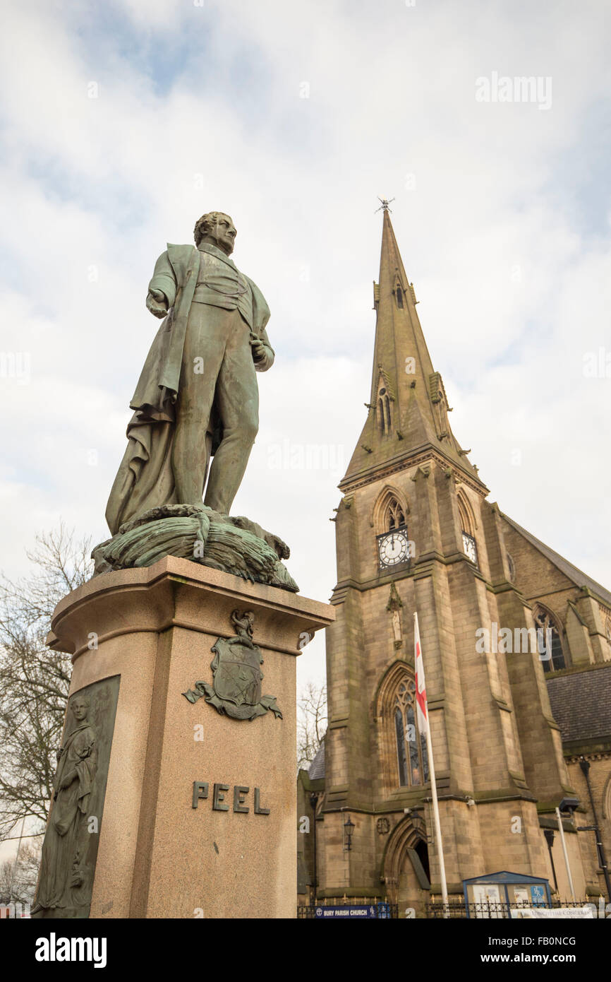 The Peel Memorial statue , Bury , with St Mary's Parish Church, Bury to the right Stock Photo