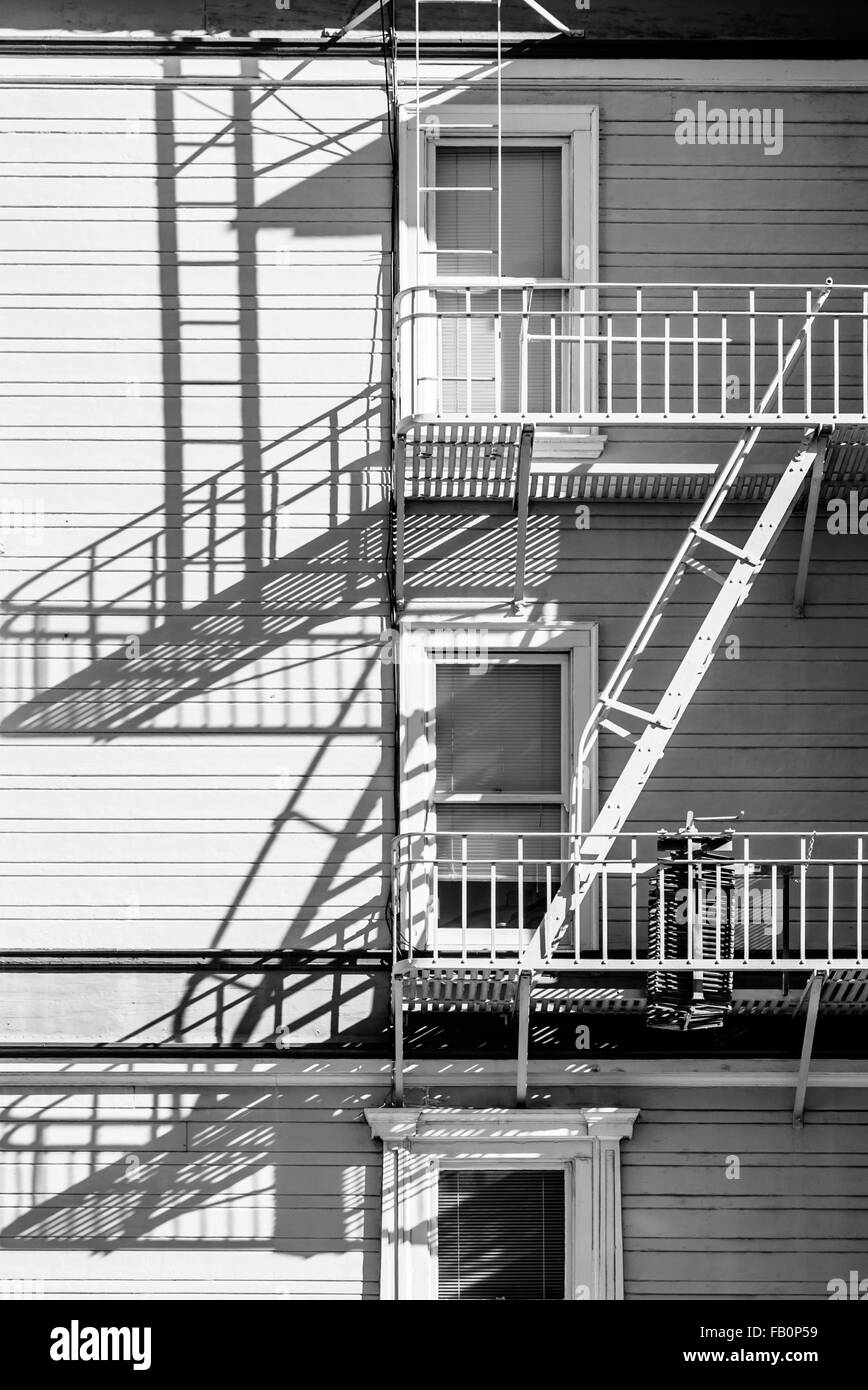 Emergency fire escapes on houses in San Francisco, CA with shadows Stock Photo