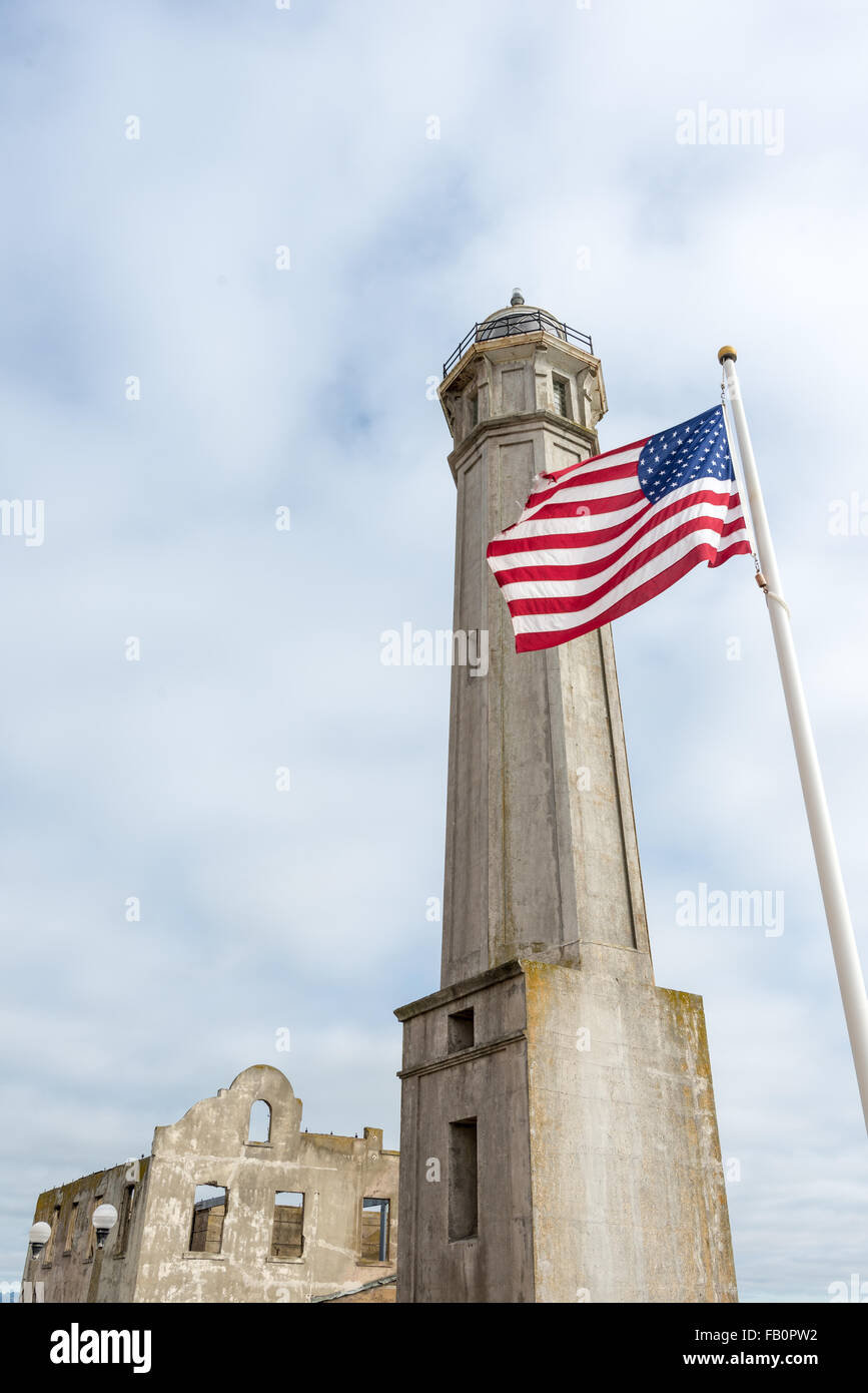 Lighthouse, Governor's residence and US flag on Alcatraz Island close to San Francisco Stock Photo