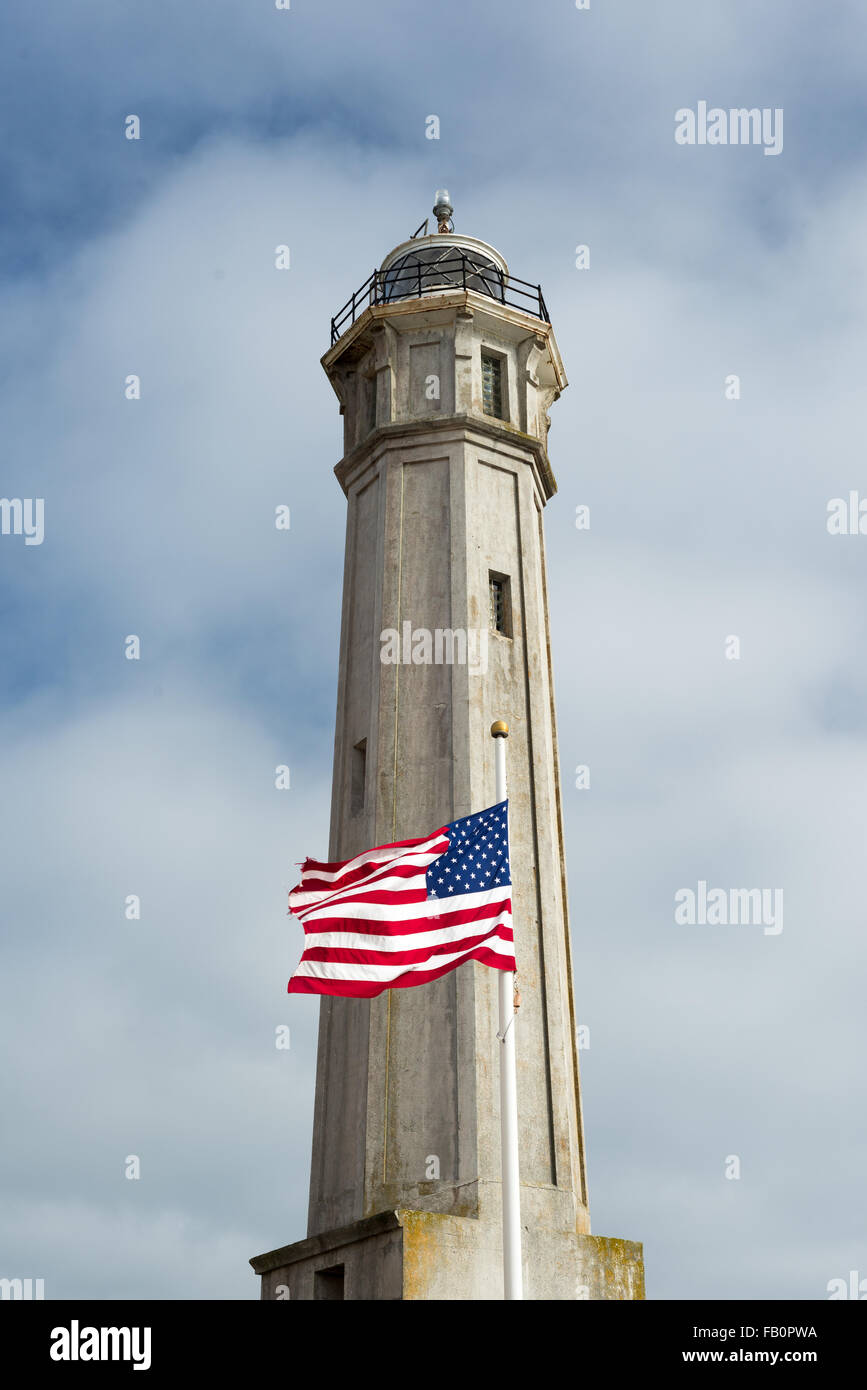 Alcatraz lighthouse and US flag Stock Photo