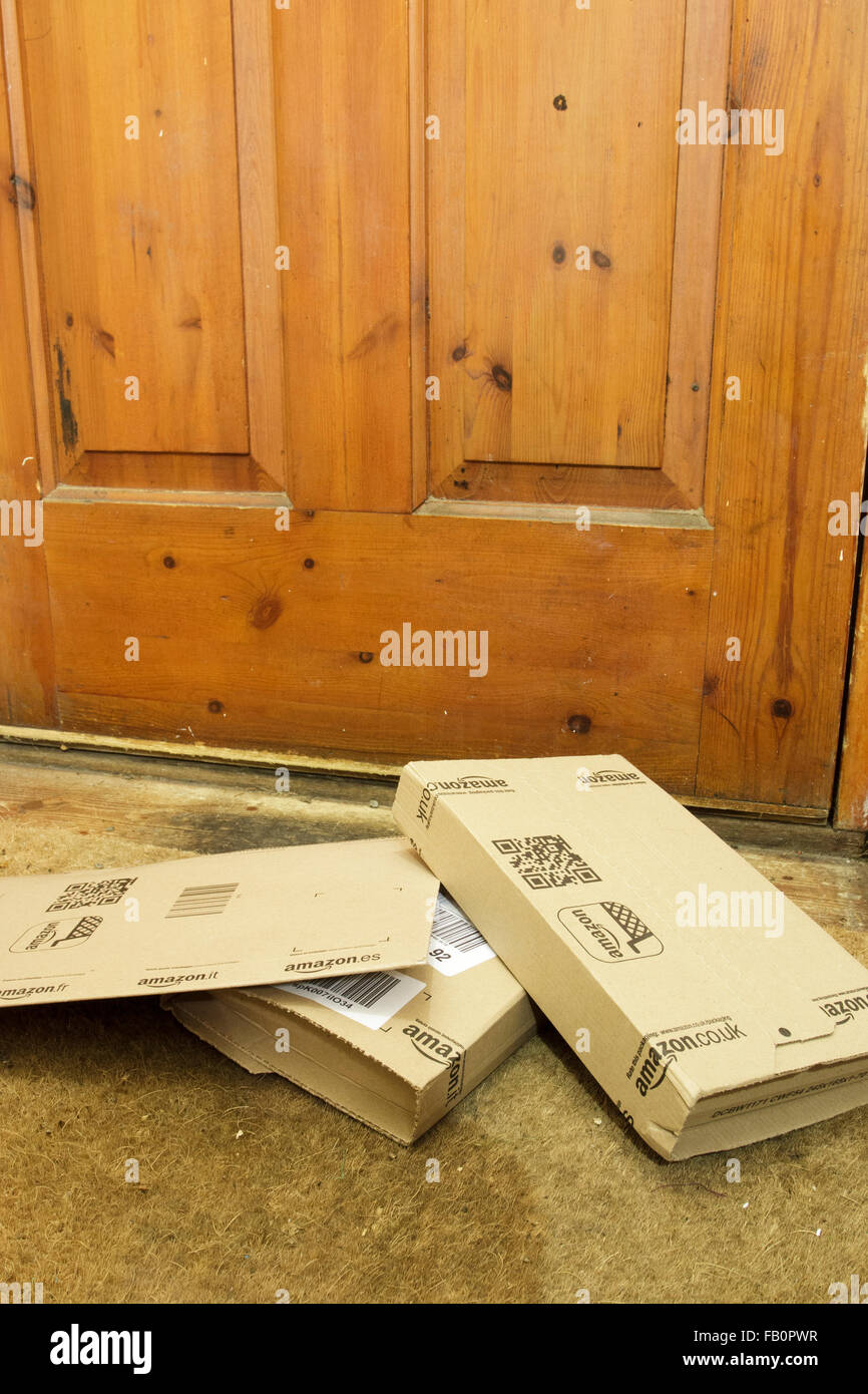 Amazon delivery boxes on the floor by the front door of house in England, UK Stock Photo