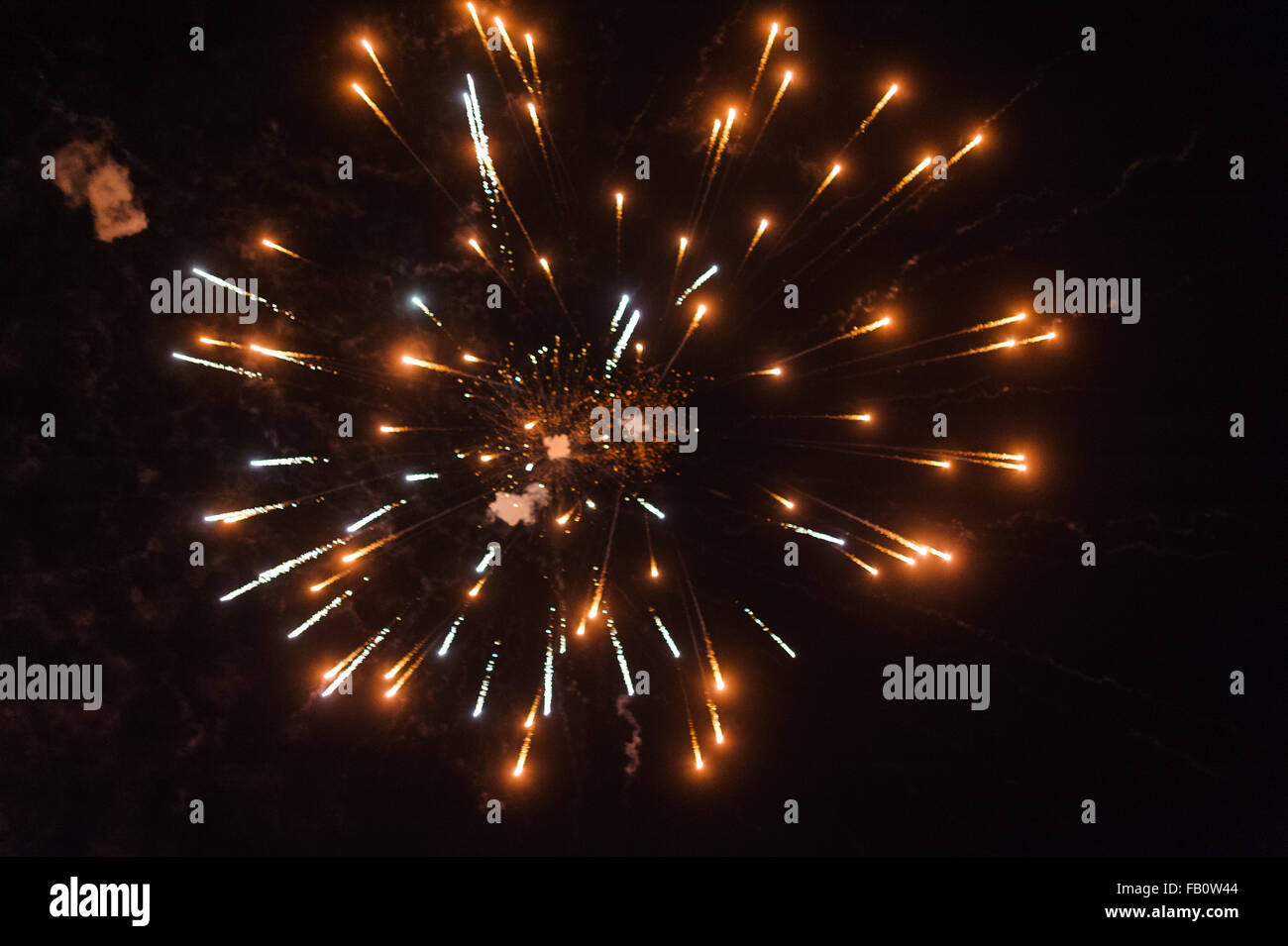 Cluster of colourful fireworks against dark sky Stock Photo - Alamy