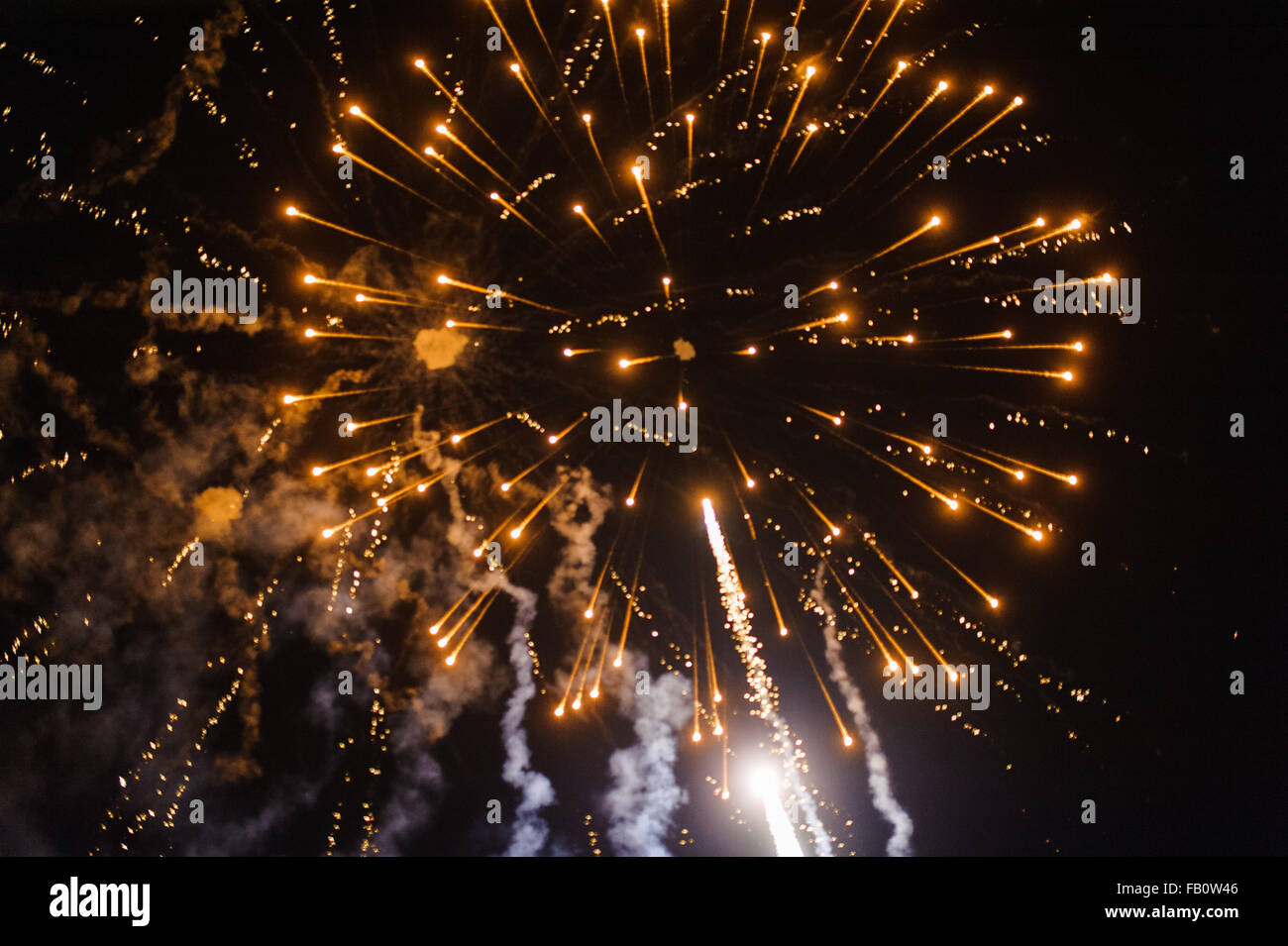 Cluster of colourful fireworks against dark sky Stock Photo - Alamy