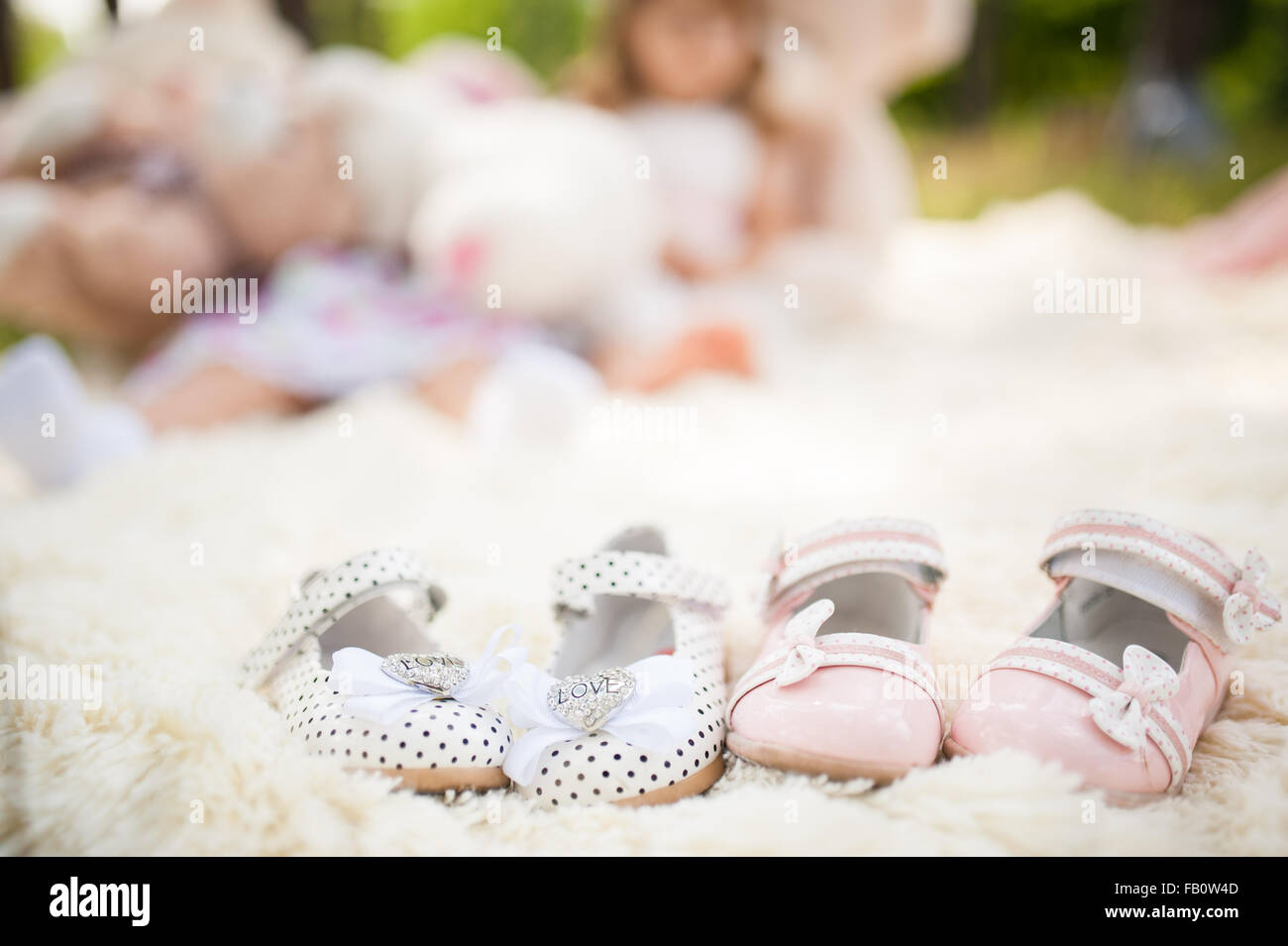 Baby shoes for a two girls summer outdoor Stock Photo