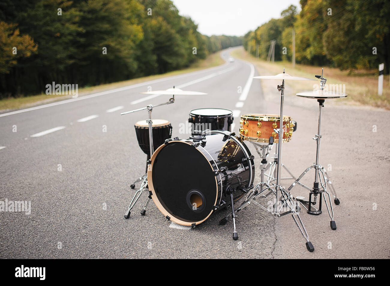 Drum Set on the road summer time Stock Photo