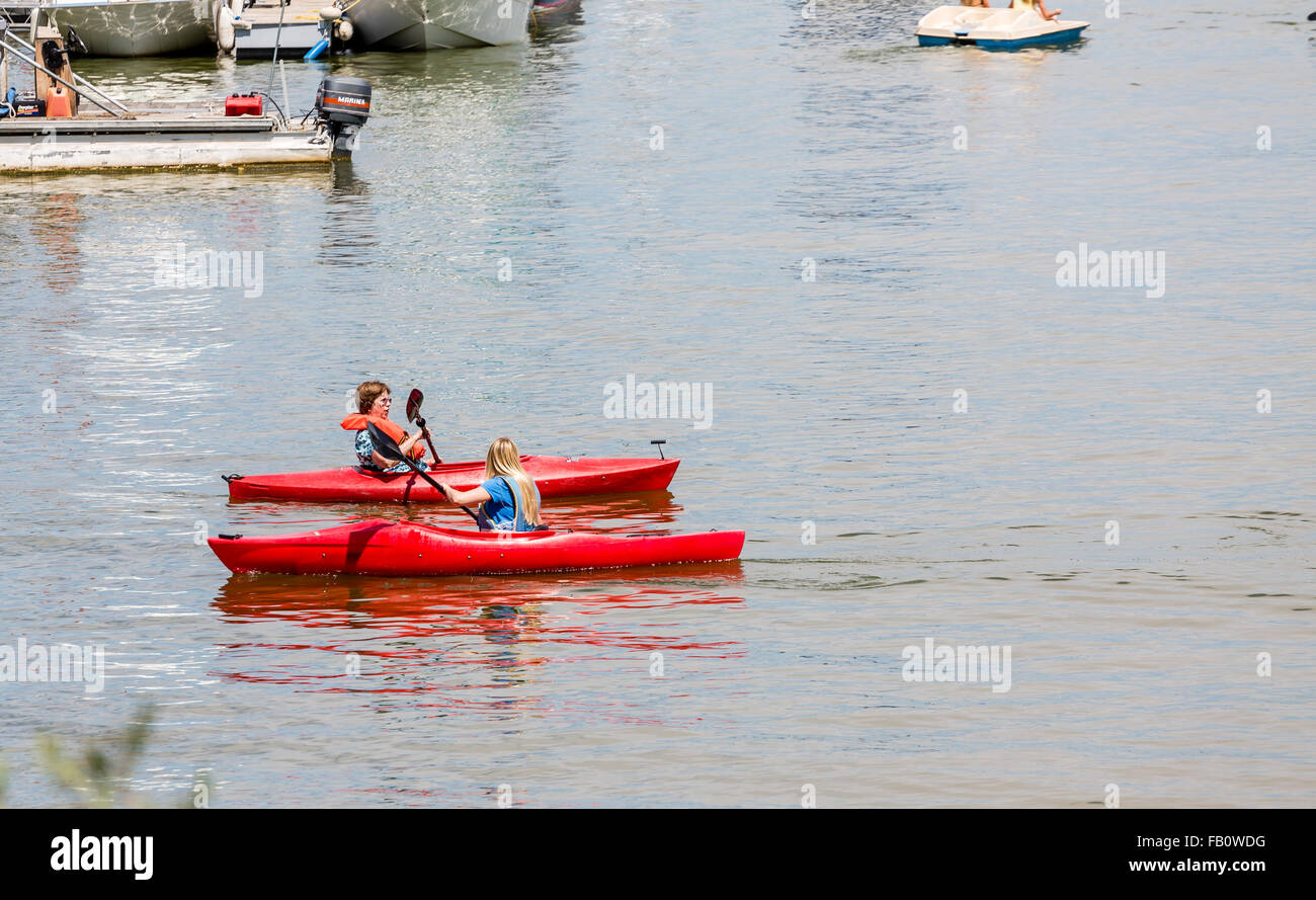 Two Women in red Kayaks Stock Photo Alamy