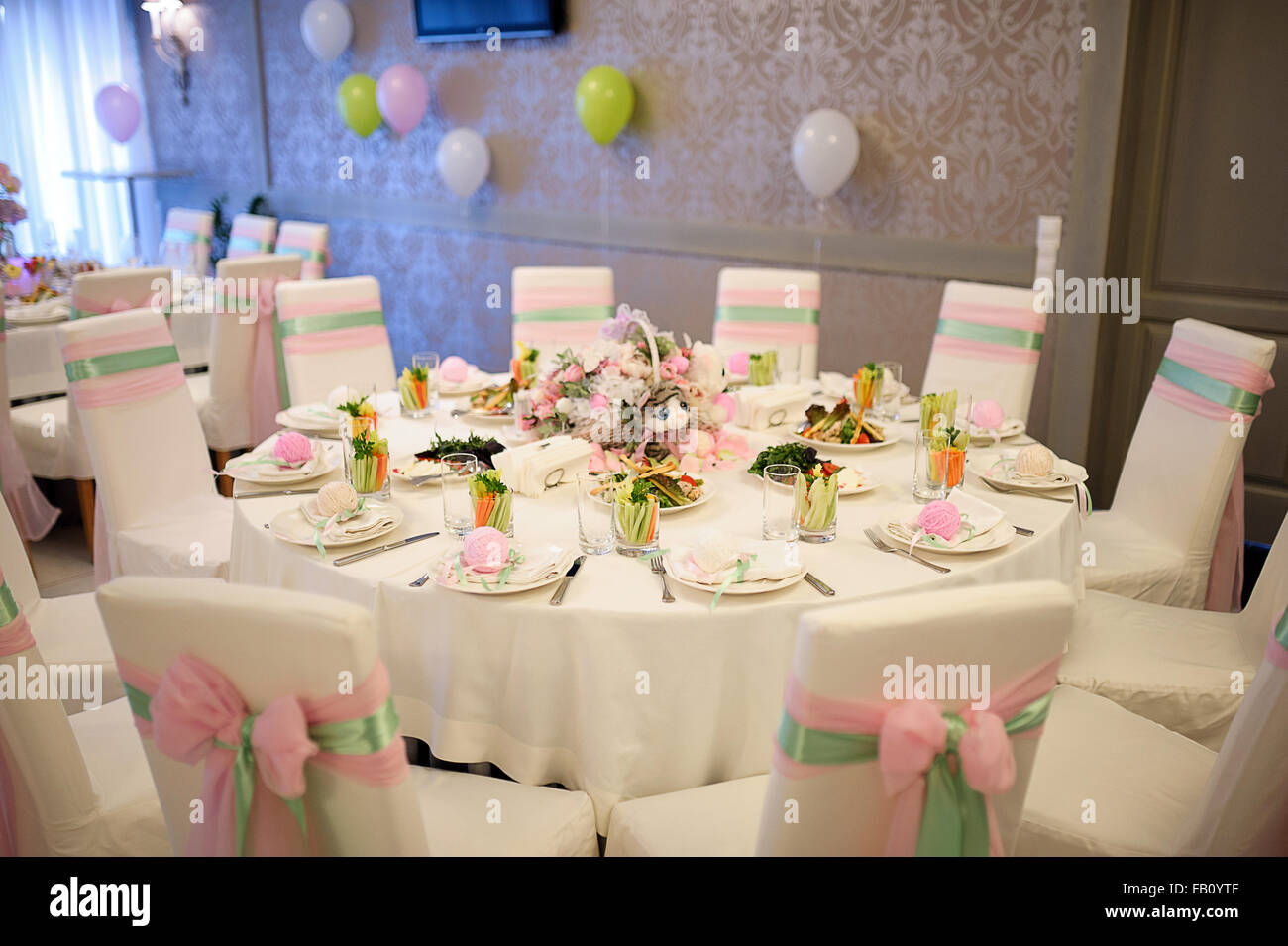 Banquet birthday table setting on evening reception Stock Photo - Alamy