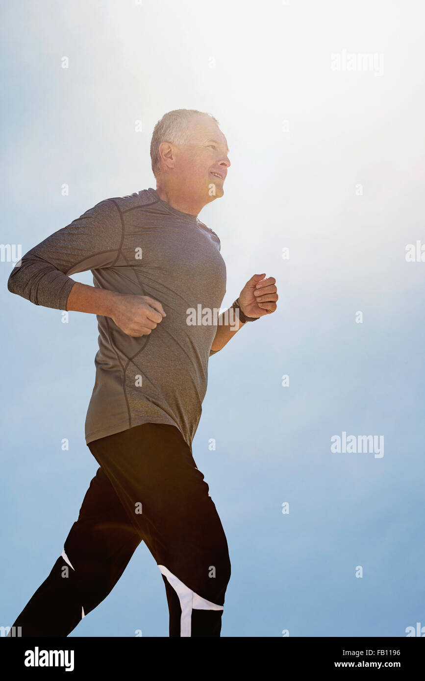 Man jogging outdoors Stock Photo