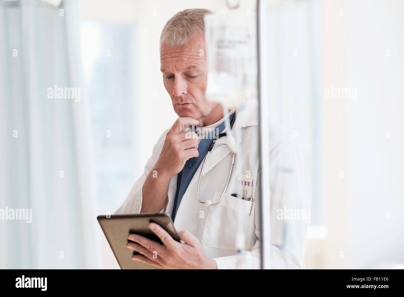 Doctor using tablet in hospital Stock Photo