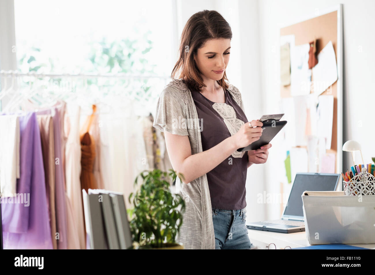 Female fashion designer in her office Stock Photo - Alamy