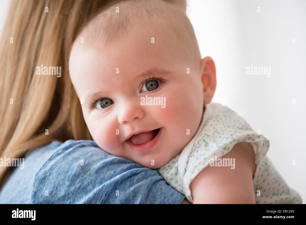 Portrait of baby girl (12-17 months) with mother Stock Photo