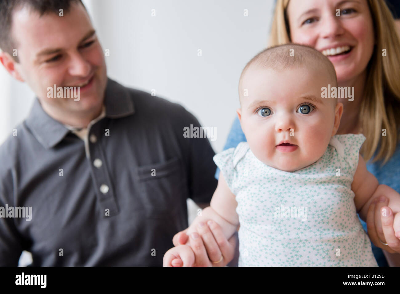 Parents with baby daughter (12-17 months) Stock Photo