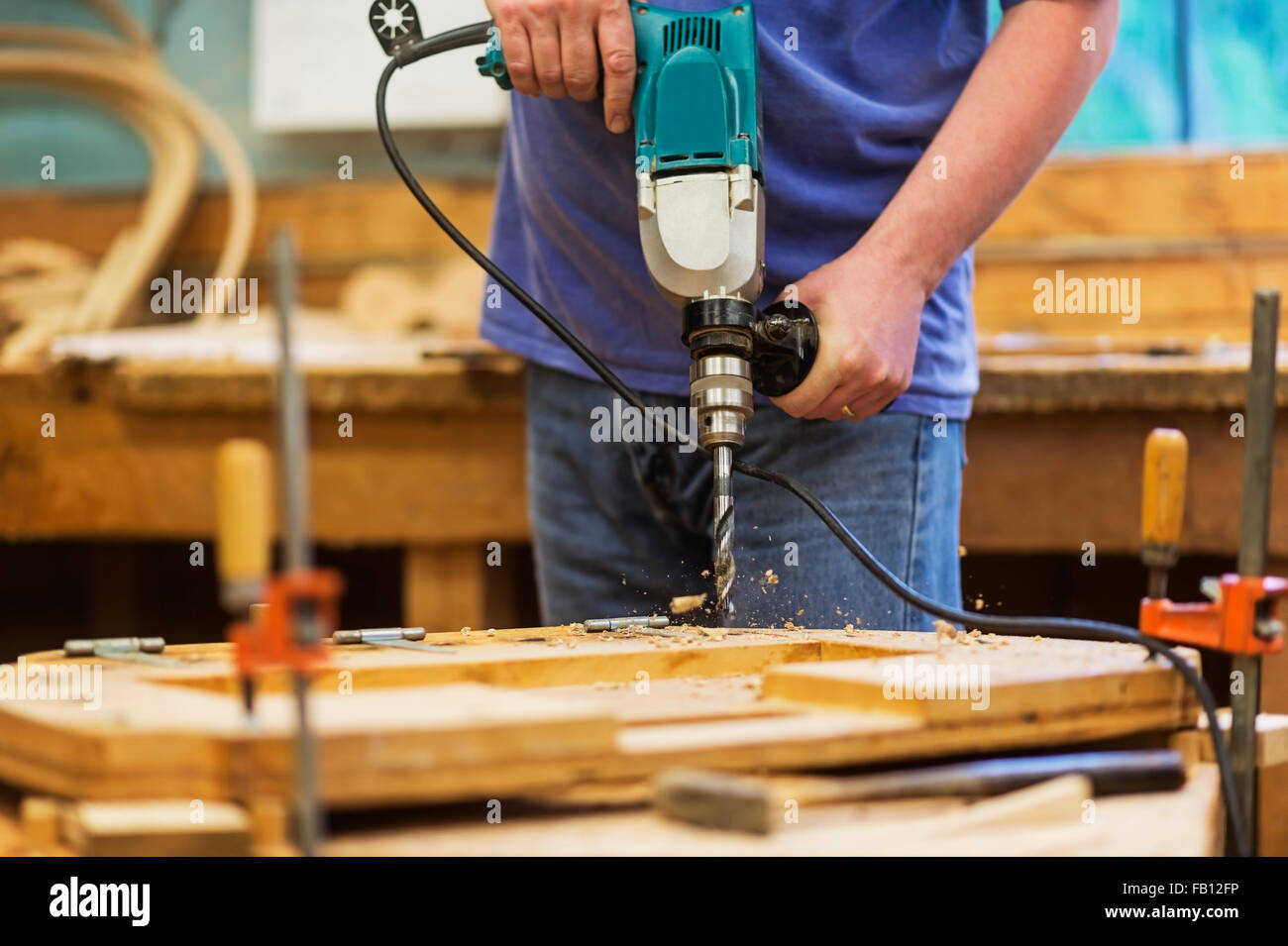 Carpenter using drill Stock Photo Alamy