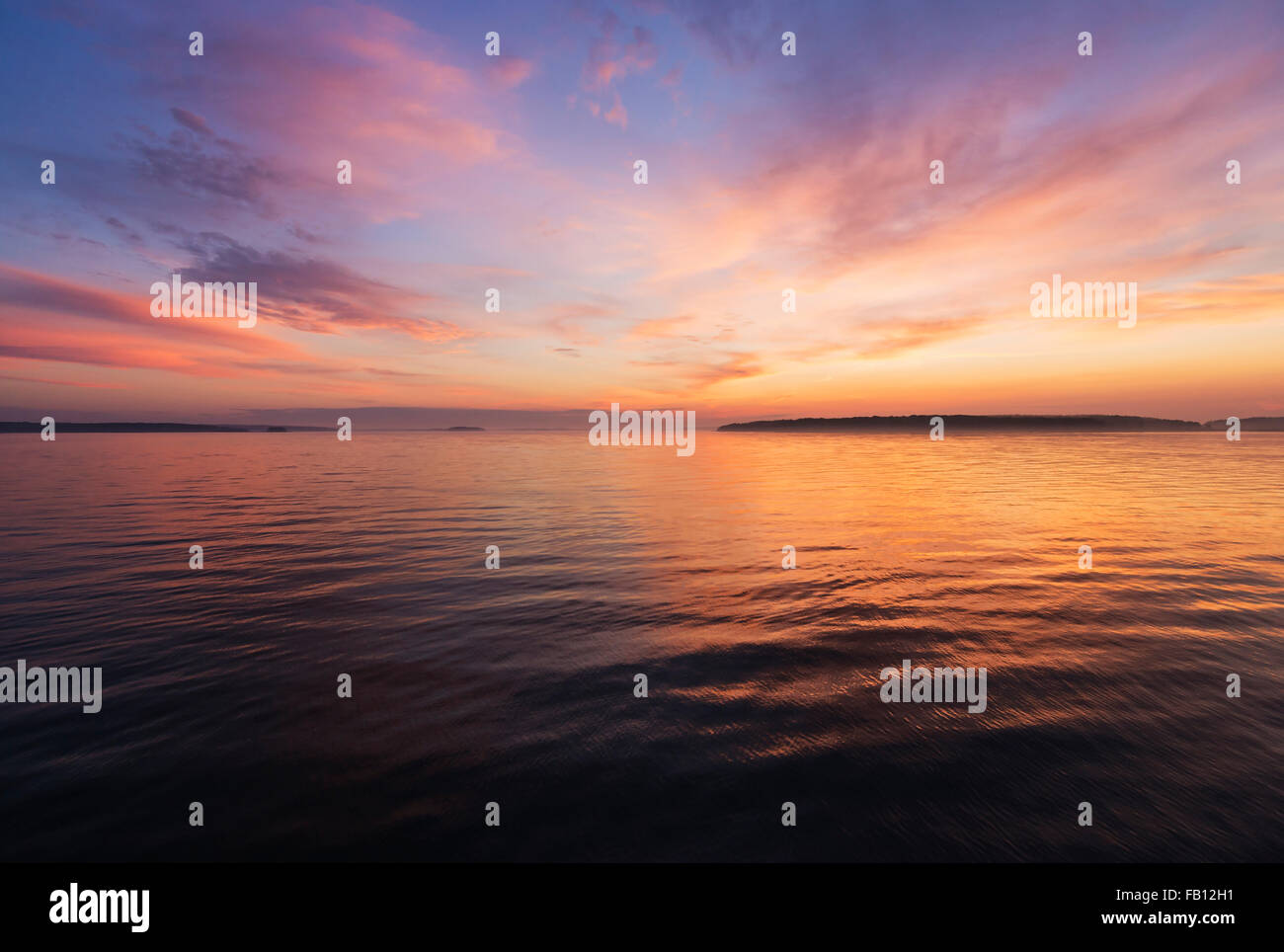 Colorful seascape at sunrise Stock Photo - Alamy