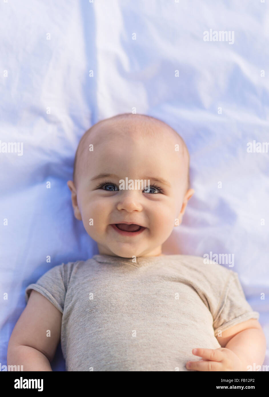 Portrait of baby boy (6-11 months) lying down Stock Photo