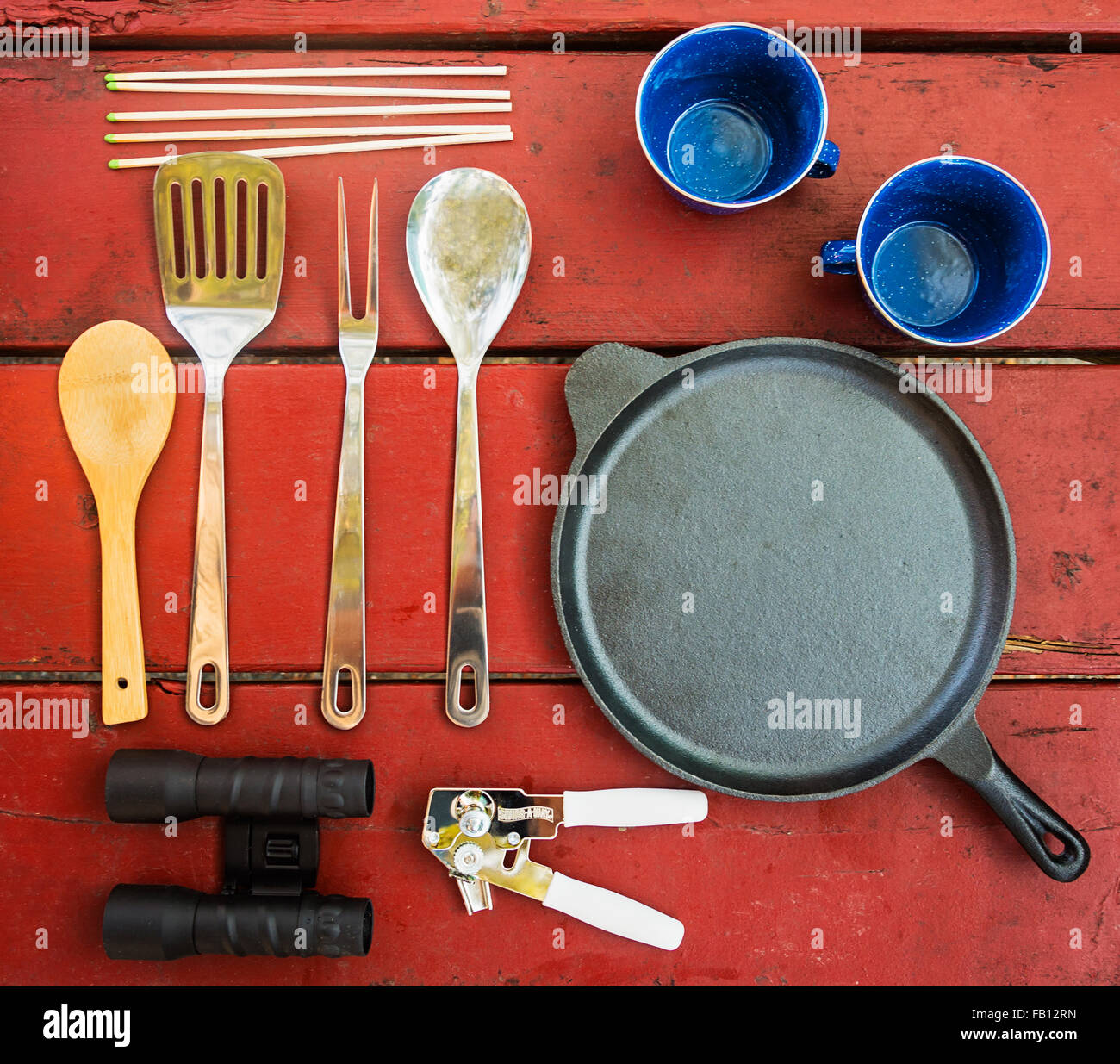 Cups and cooking utensils on picnic table hires stock photography and