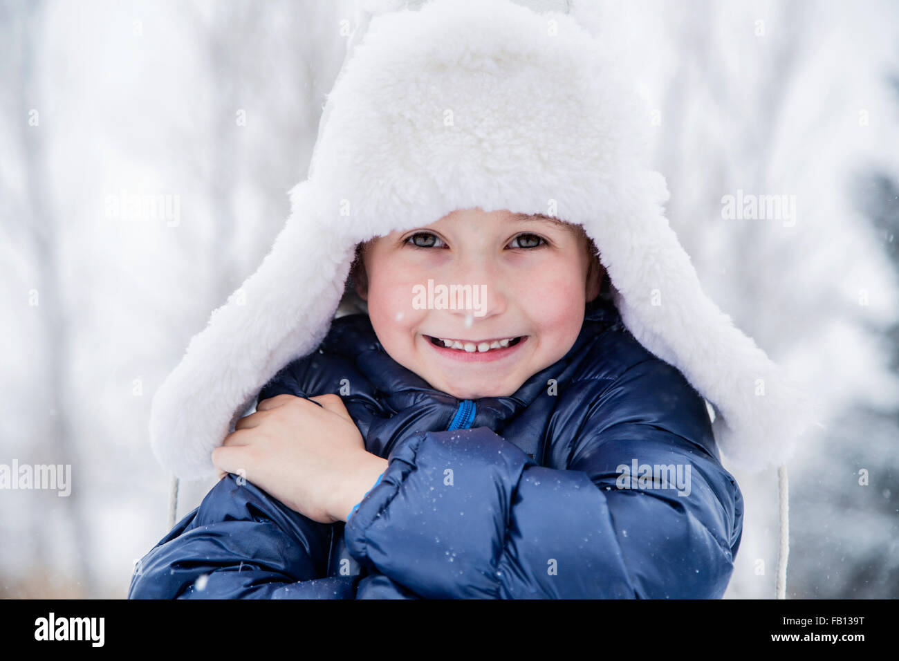 Portrait of boy (6-7) in fur hat Stock Photo