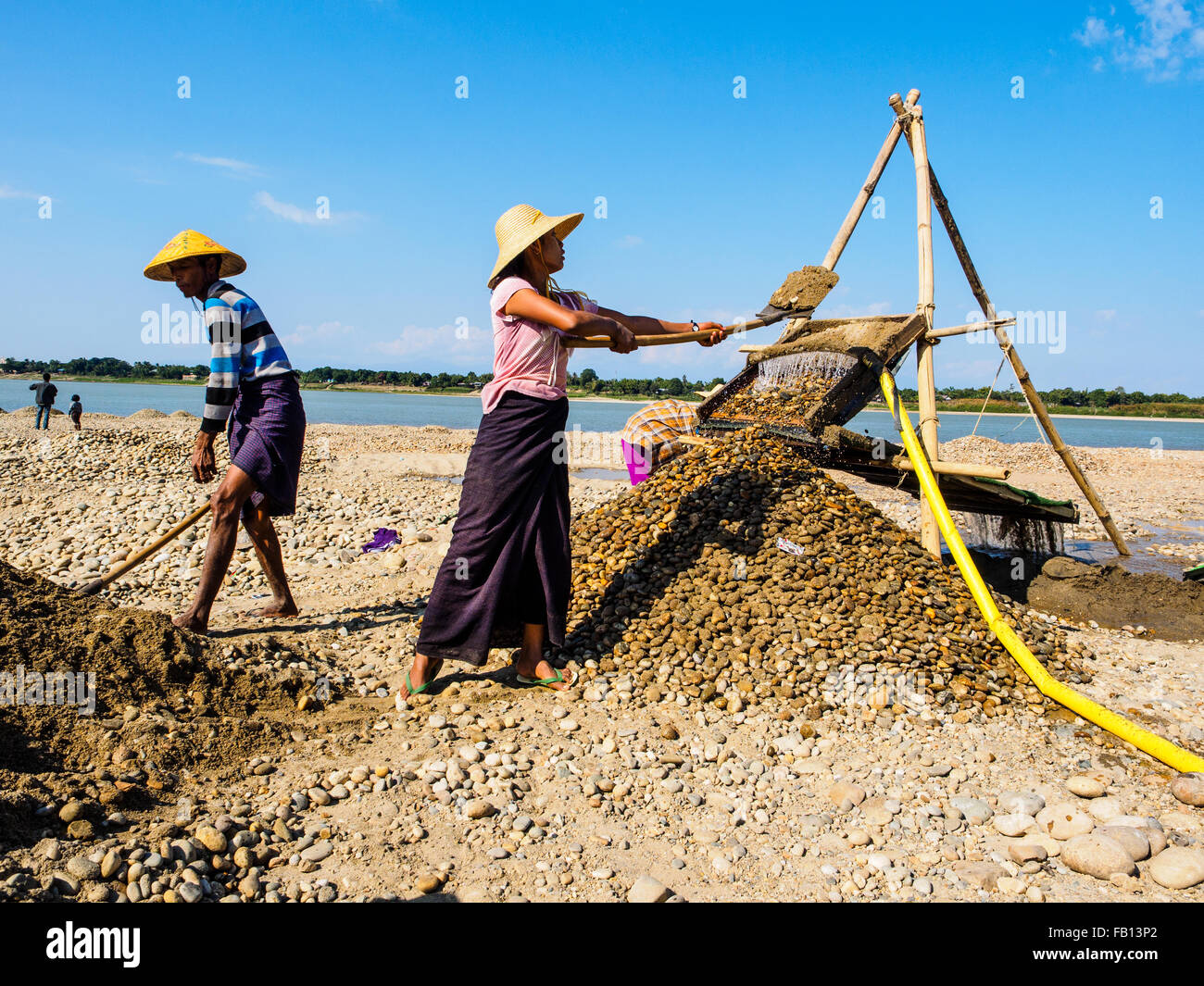Local people is looking for gold on the riverbank in Myitkyina. Stock Photo