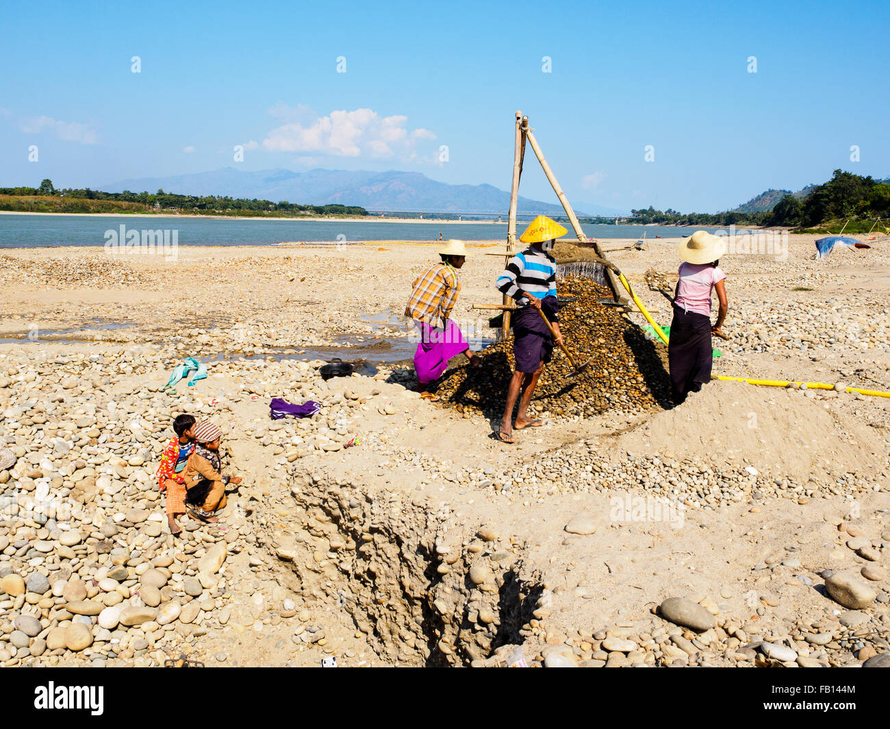 Local people is looking for gold on the riverbank in Myitkyina. Stock Photo