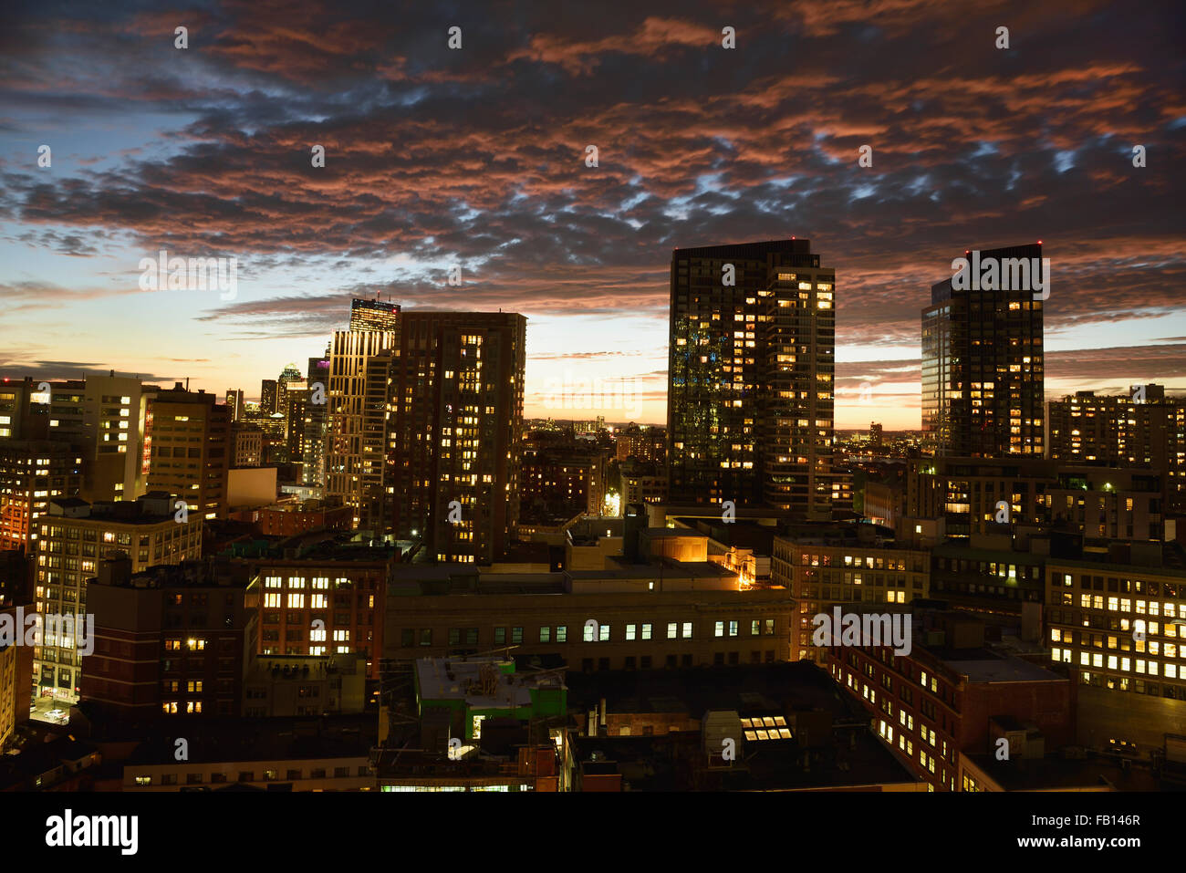 Dramatic sky over city at dusk Stock Photo