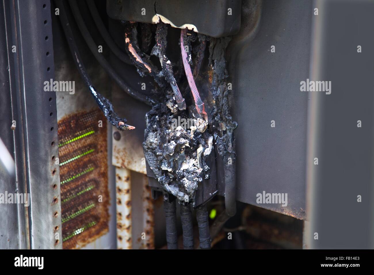 A burnt out 3 phase power box and cable, Thailand Stock Photo