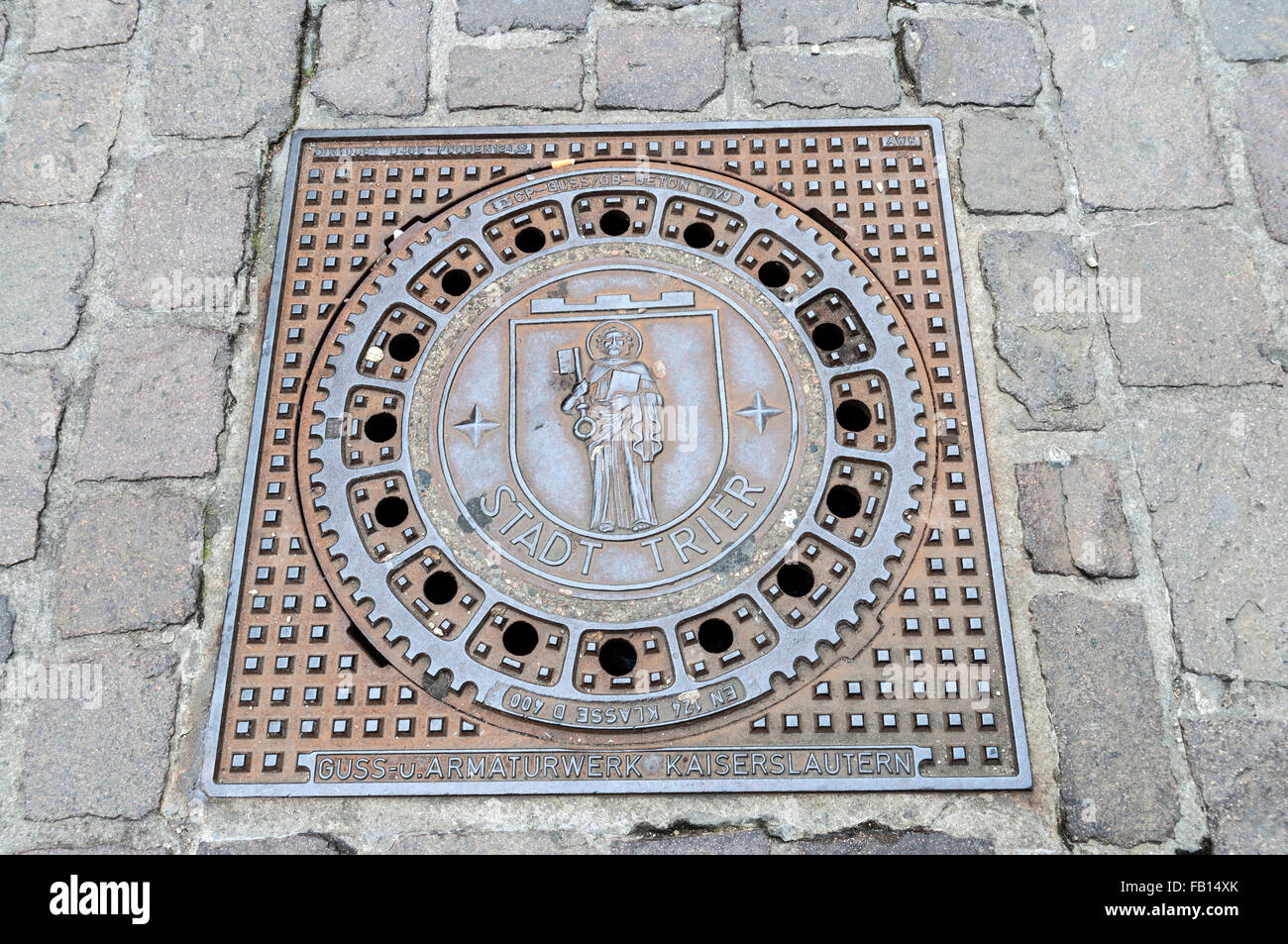 Decorative man hole cover in Trier, Germany. Stock Photo