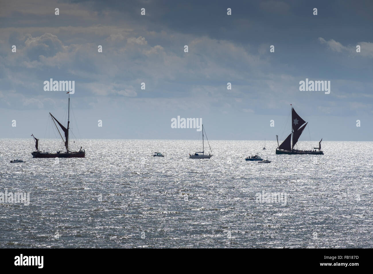 historic thames sailing barges on a sunny day, offshore from Clacton on sea, essex, england, uk. Stock Photo