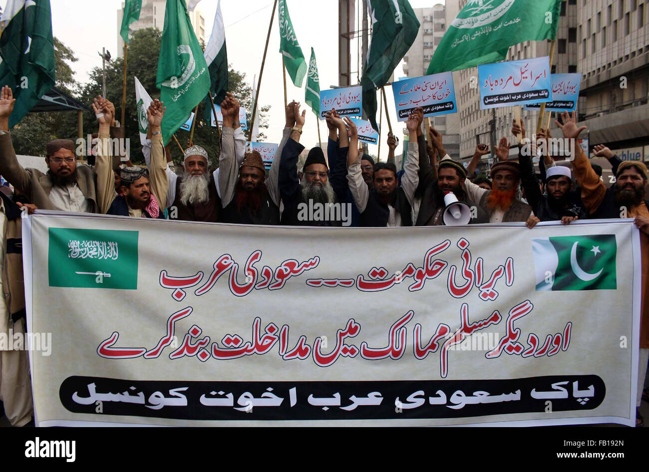 Members of Pak Saudi Arabia Akhowat Council chant slogans against America, Israel and Iran during protest demonstration at Karachi press club on Thursday, January 07, 2016. Stock Photo