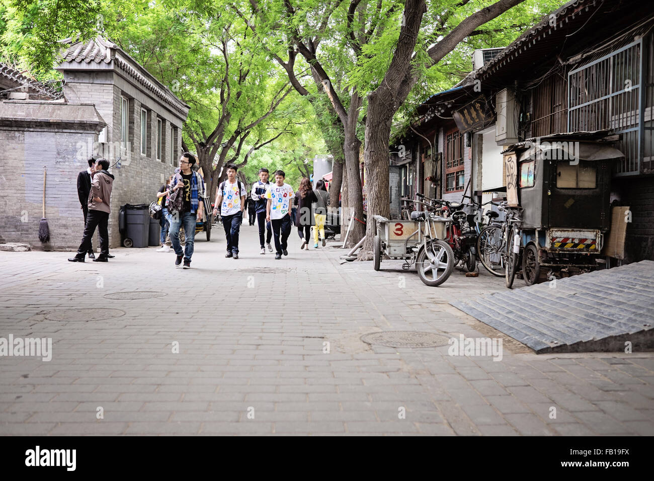 People strolling along a popular Hutong in Beijing, China Stock Photo