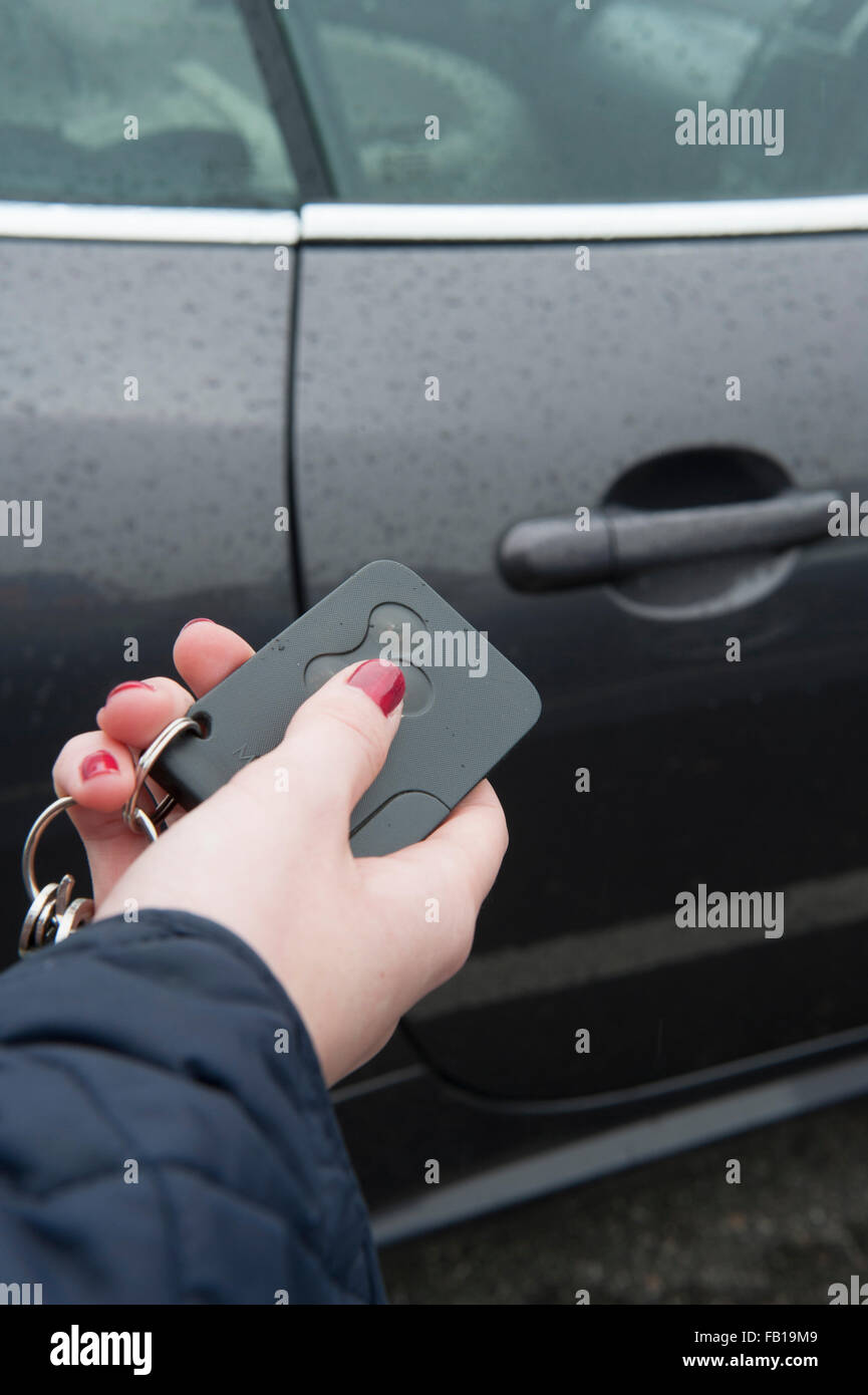 Person unlocking a car with a keyless fob Stock Photo Alamy
