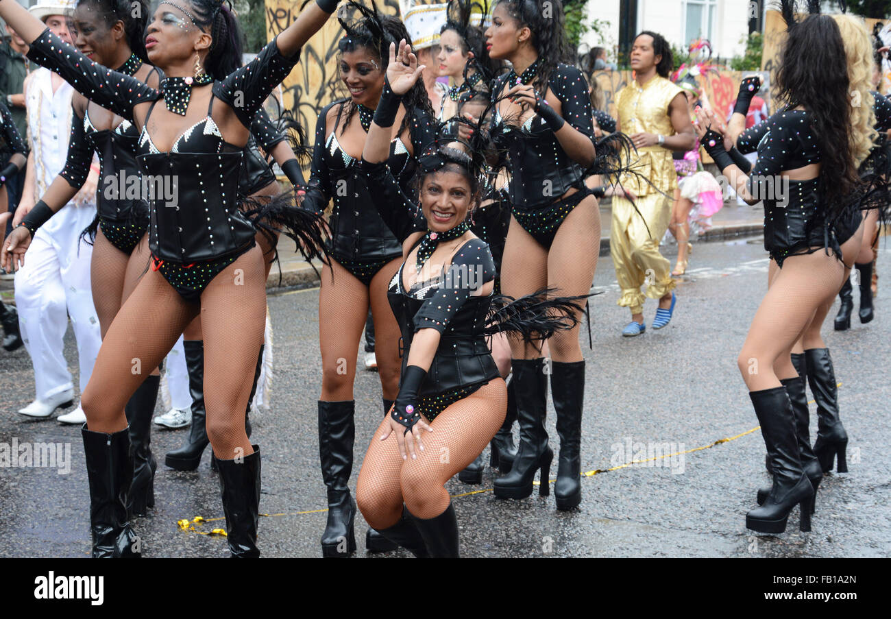 Dancers in black leather, at Notting Hill carnival. London, England. Stock Photo