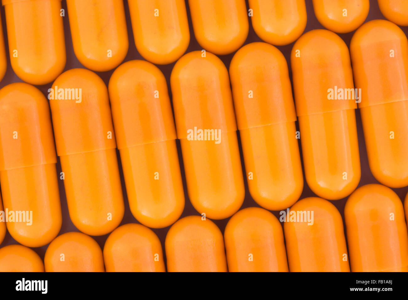 Closeup of orange pills capsule form made of gelatin (these orange