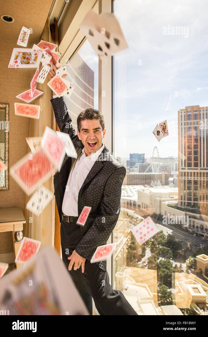 Male magician throwing playing cards , Las Vegas, Nevada, USA Stock