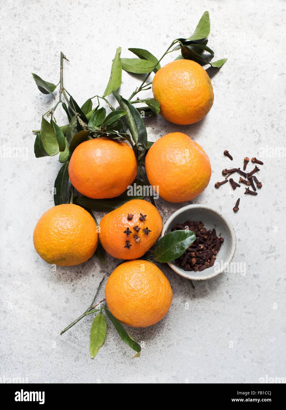 Overhead view of oranges decorated with cloves Stock Photo