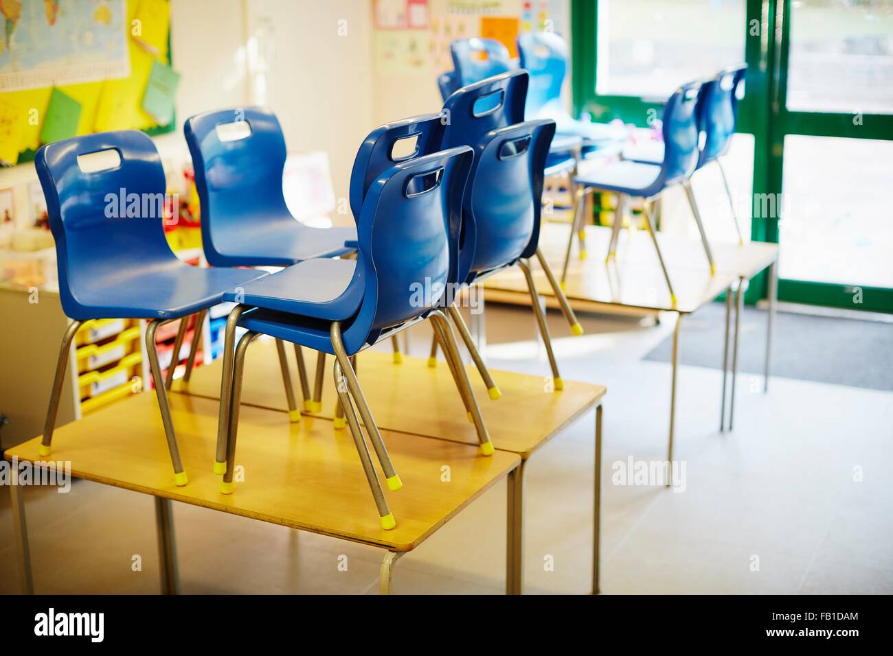 Empty Classroom With Chairs On Desk In Elementary School