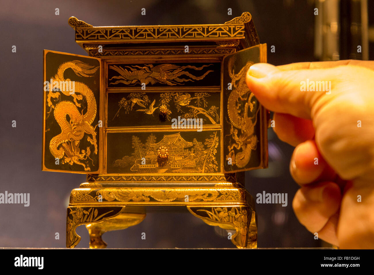 London, UK. 7 January 2016. A parcel gilt bronze inlaid miniature cabinet on self-stand, circa 1900, 12cm high, GBP 8850 from Hickmet Fine Arts. The Mayfair Antiques and Fine Art Fair opens with an impressive array of unique and rare antiques for sale from around the world at The London Marriott Hotel Grosvenor Square and runs until 10 January. Stock Photo
