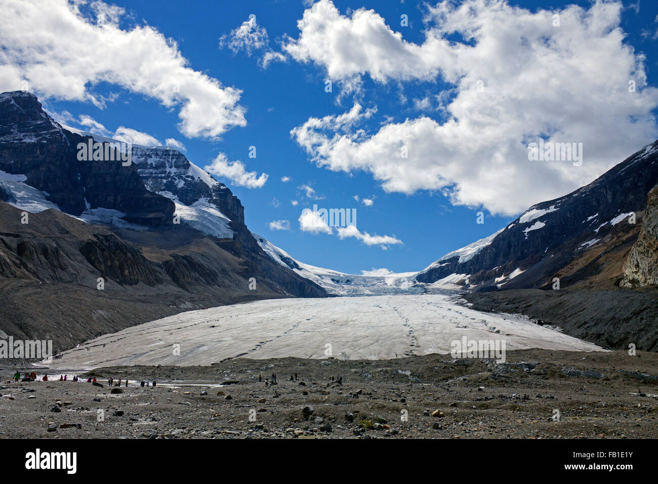 Tourists visiting receding Athabasca Glacier, part of the Columbia Icefield in the Canadian Rockies, Jasper NP, Alberta, Canada Stock Photo