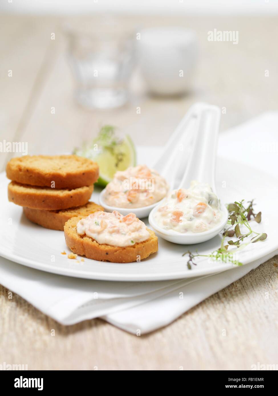 Scottish lochmuir salmon pate and tartare dipping platter with toasted bread crackers Stock Photo